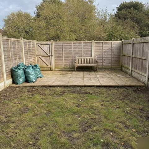 Cleared garden with tidy lawn and waste bags after Tunbridge Wells clearance