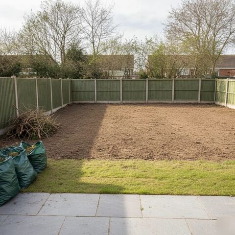 Cleared garden with exposed fence and soil after overgrown clearance in Tunbridge Wells