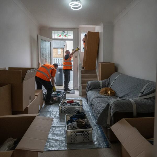 House clearance team carrying furniture from a Tunbridge Wells home into a waiting van